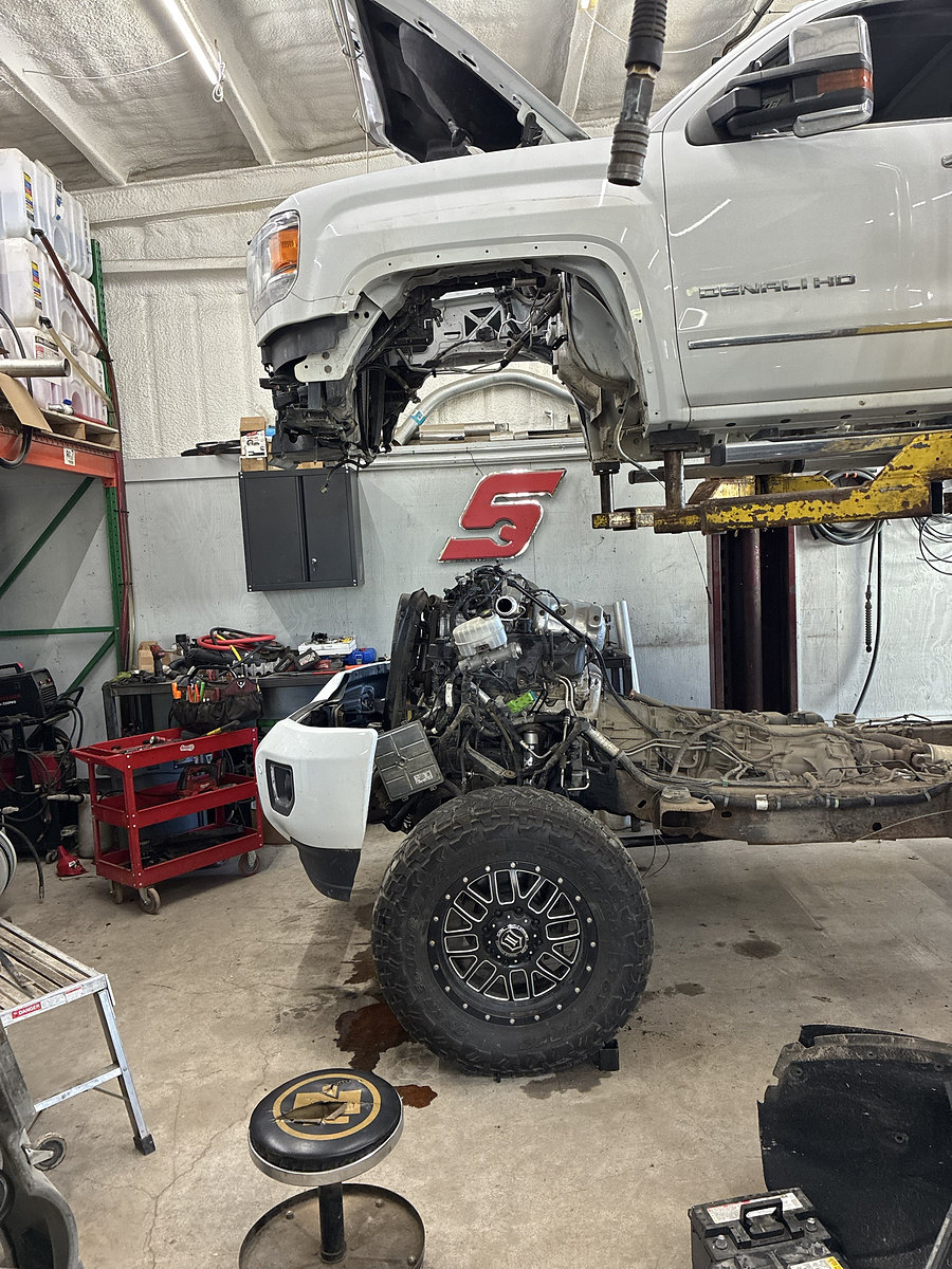 GMC Denali HD on a lift for engine work