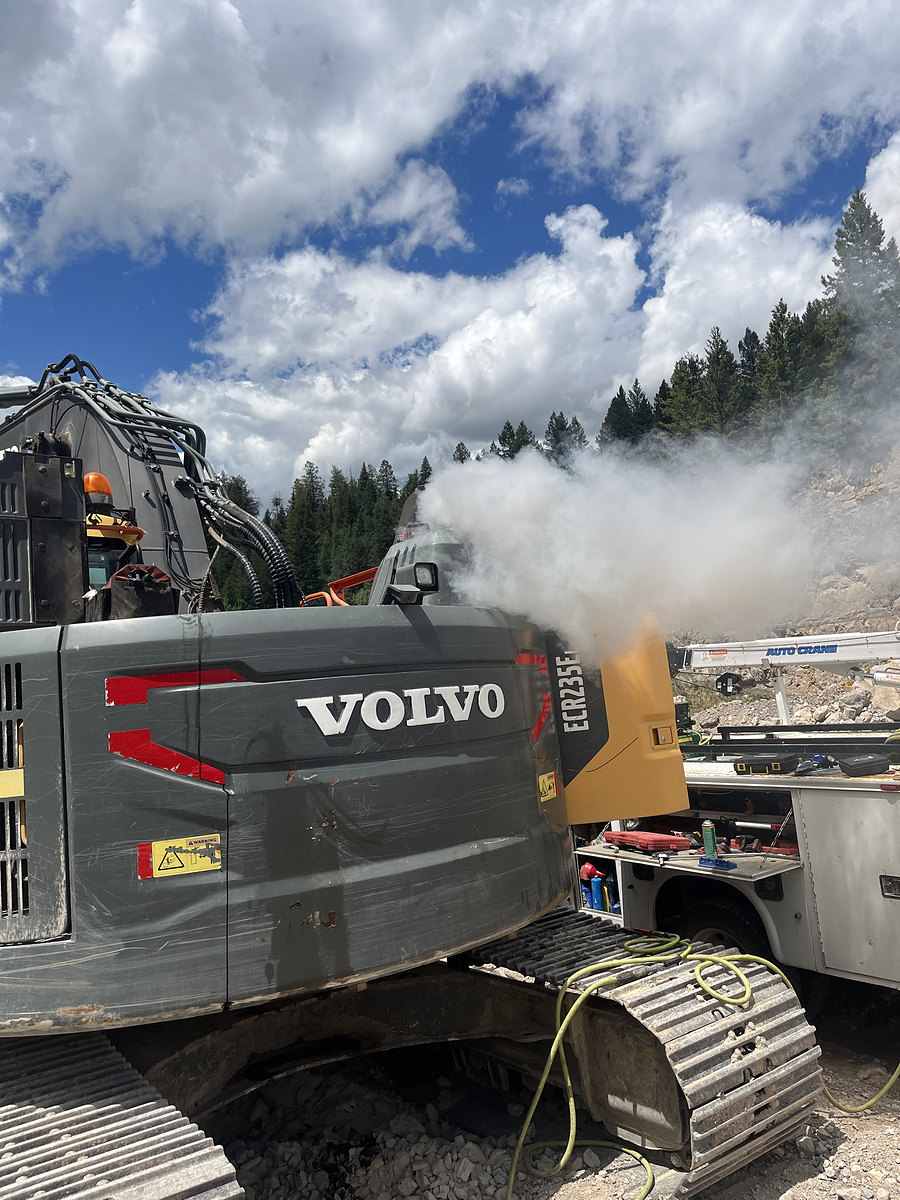 Volvo excavator being serviced on a job site